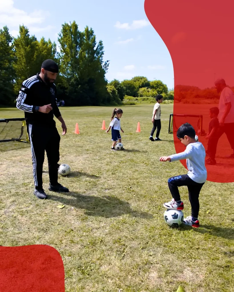 Qualified youth football coach training children at Forest Gate E7